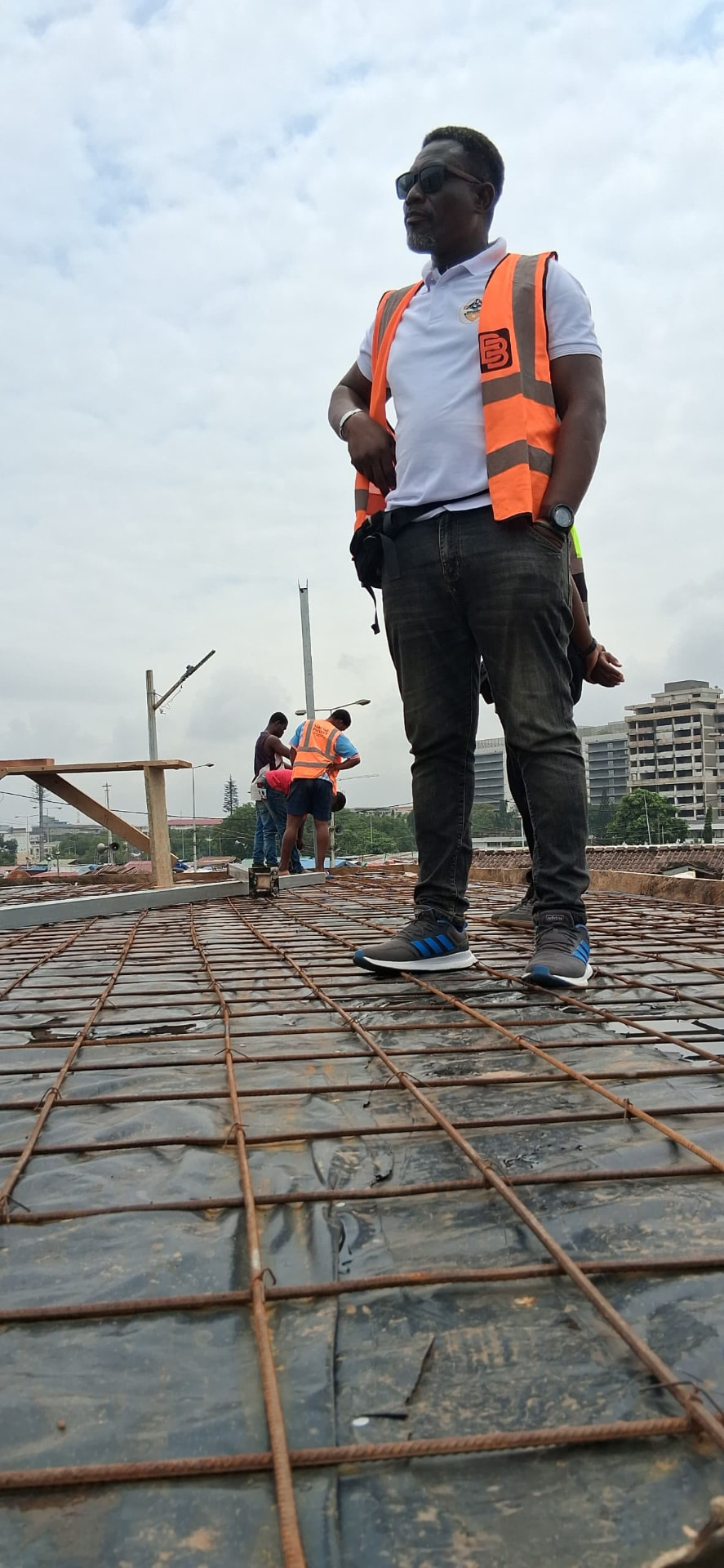 Henry Bart Plange, founder and CEO of Bart The Builder, on an active construction site in Accra